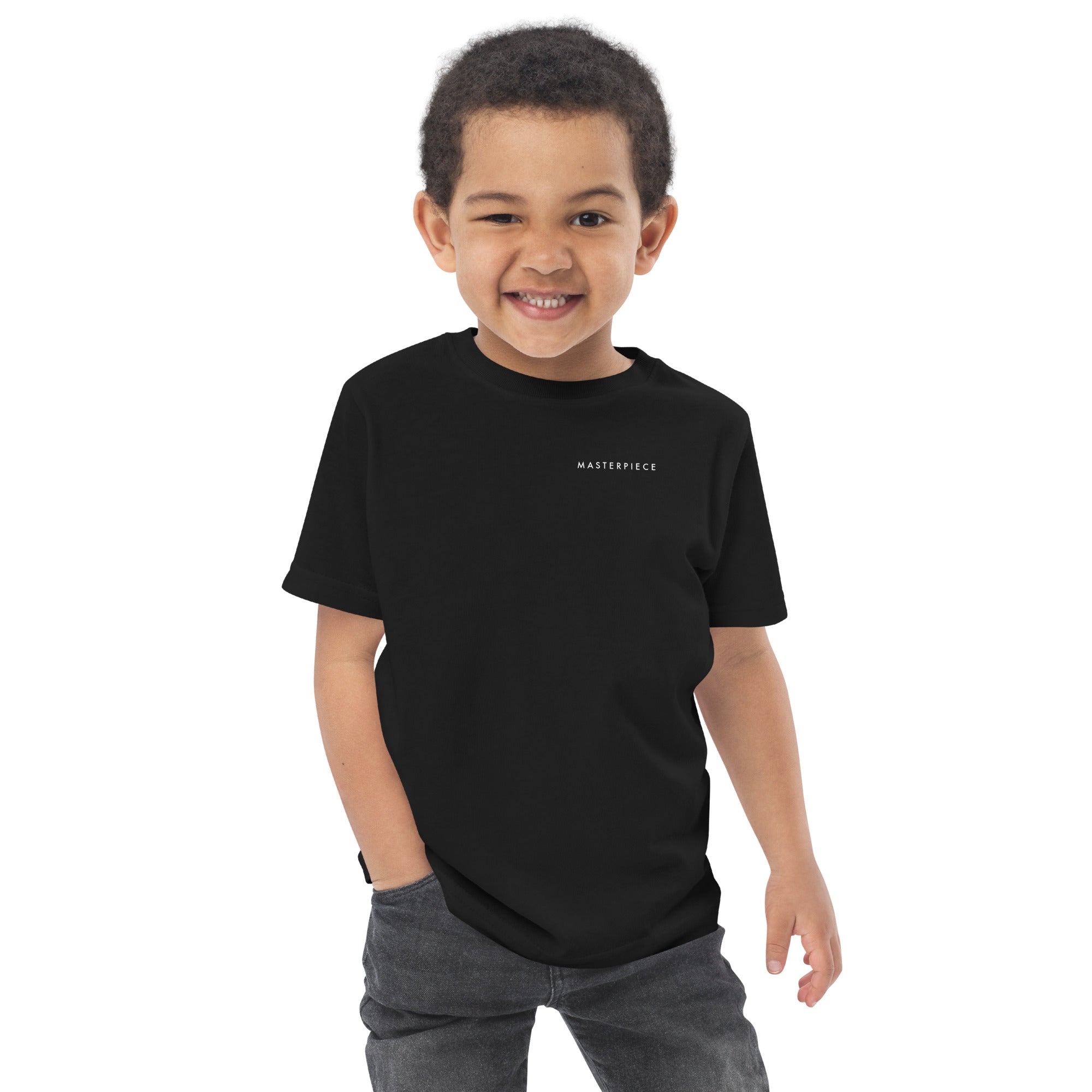 Child wearing a black t-shirt with 'MASTERPIECE' logo Lotta Sirén Art  shirt on a white background