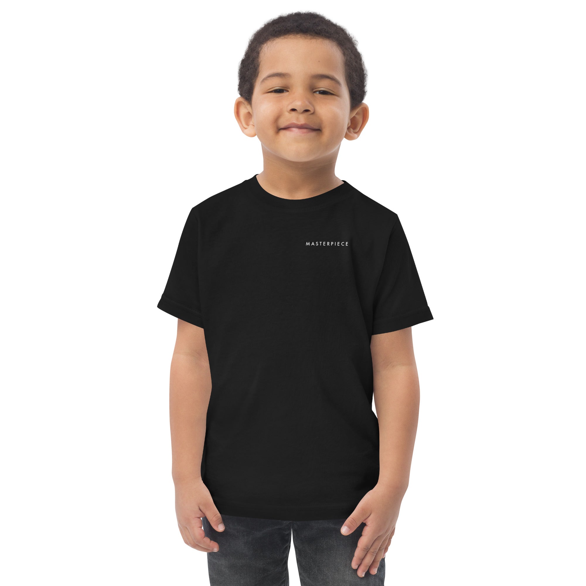 Child wearing a black t-shirt with 'MASTERPIECE' logo Lotta Sirén Art  shirt on a white background