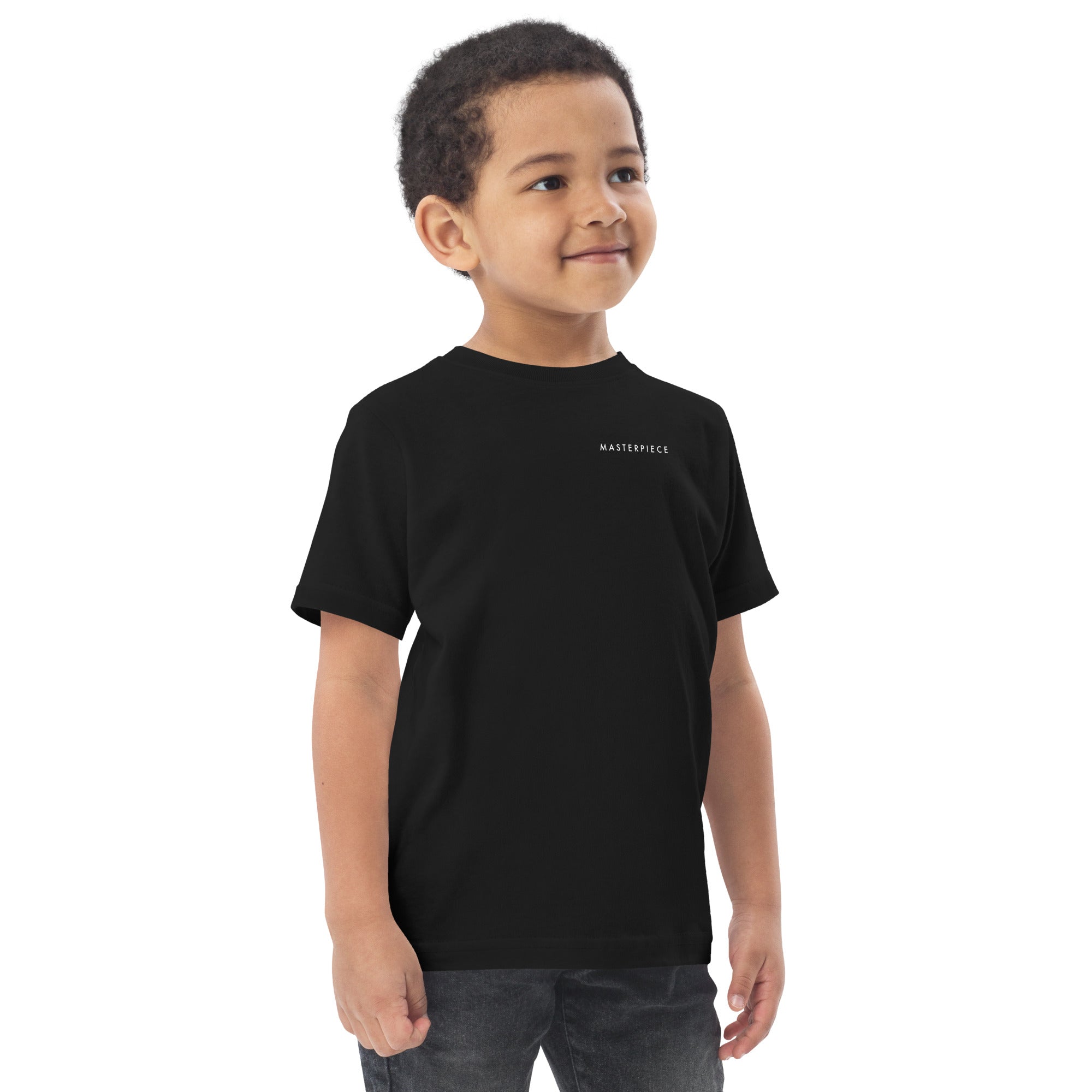 Child wearing a black t-shirt with 'MASTERPIECE' logo Lotta Sirén Art shirt on a white background
